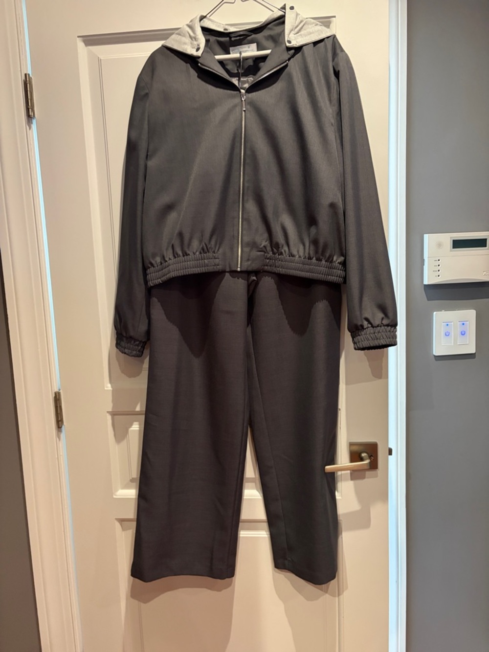 Two-Piece Dark Gray Hooded Jacket and Pants Set. With removable hood.